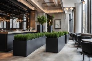 Matte black rectangular fiberglass planters inside of a restaurant in New York City